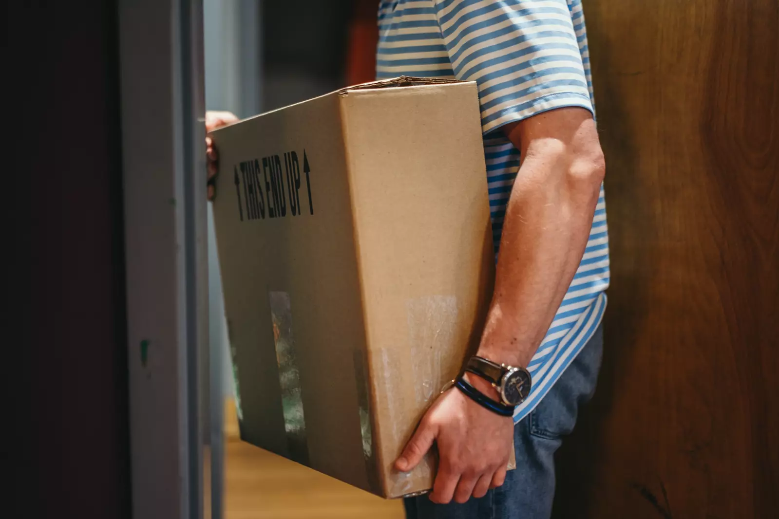 man carrying Tennessee Homemade Wines box