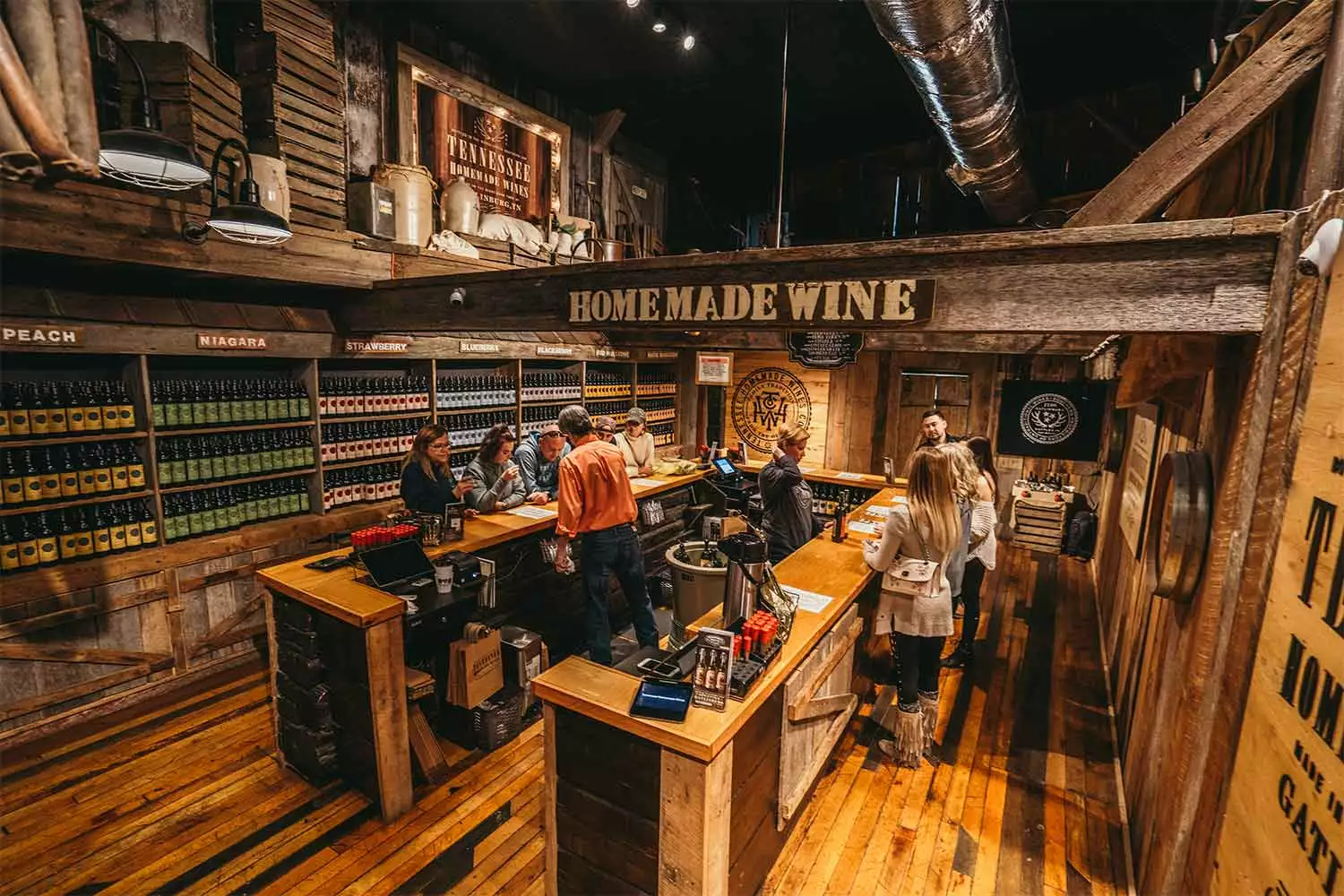 People enjoying free wine tasting at Tennessee Homemade Wines in Gatlinburg, Tennessee.