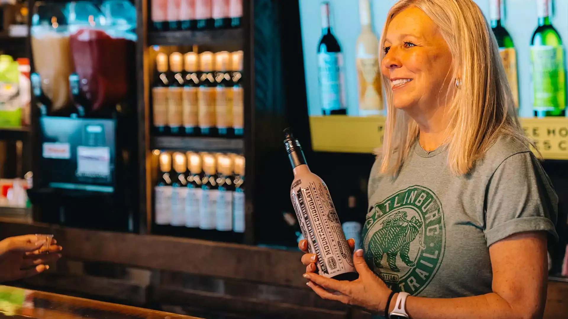 An employee discussing the Gatlinburg Winery Trail.